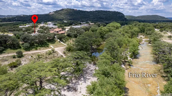 an aerial view of house with yard