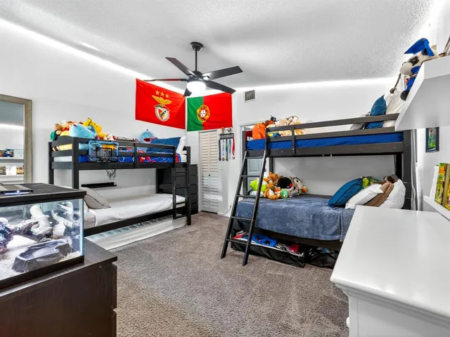 a bedroom with furniture and natural light