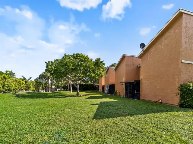 a view of a house with a big yard
