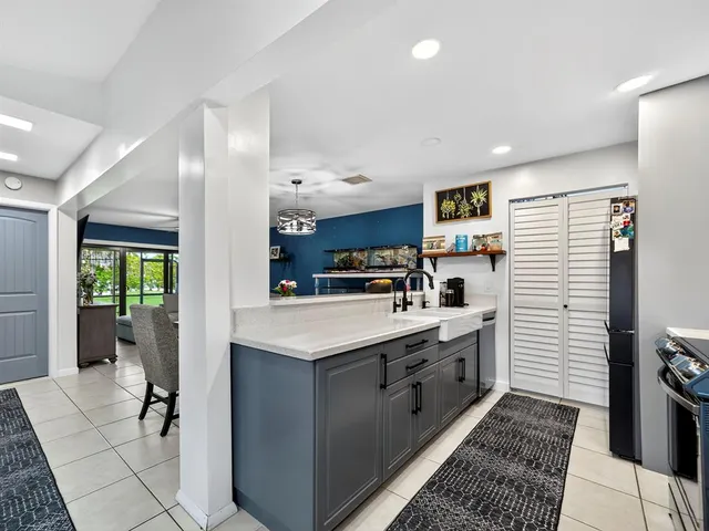 a kitchen with stainless steel appliances granite countertop a sink and cabinets
