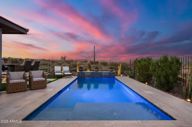 a view of a swimming pool and lounge chair