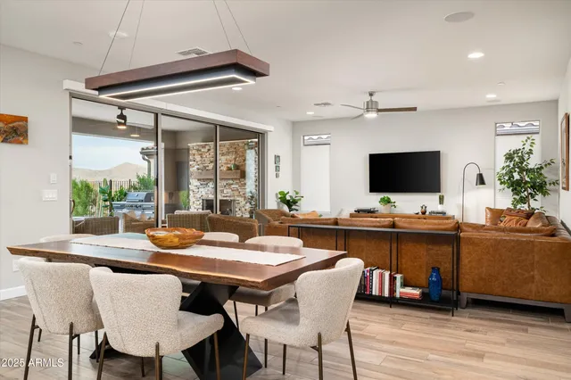 a view of a dining room with furniture window and wooden floor