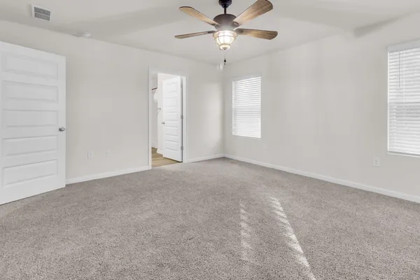 a view of an empty room with a window
