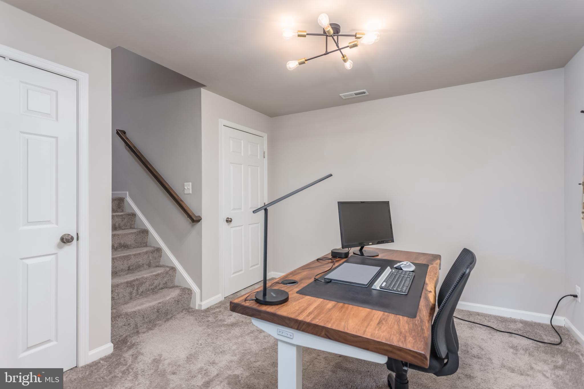 122 Patchwork Drive Stephenson, VA 22656 - Photo 20 of 40 a workspace with furniture and wooden floor