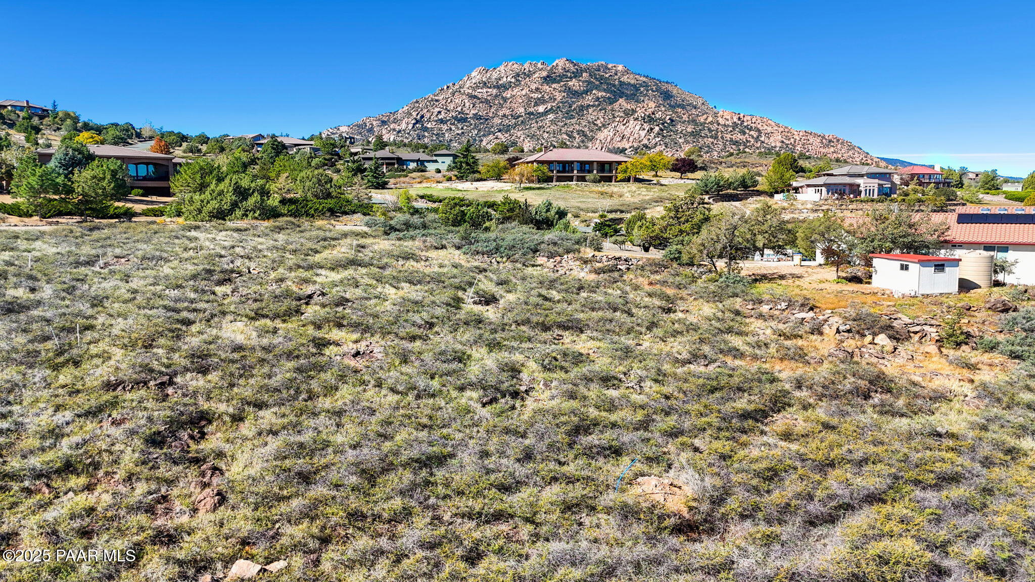 6614 North Shauna Drive Prescott, AZ 86305 - Photo 17 of 19 a view of a large building with a mountain in the background