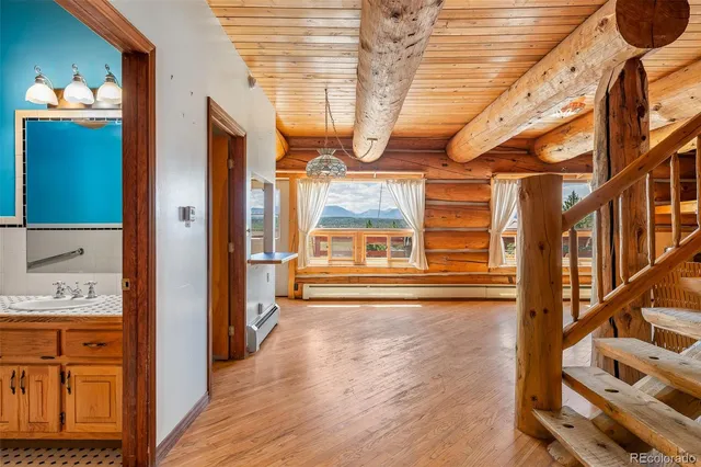 a view of an entryway with wooden floor and door