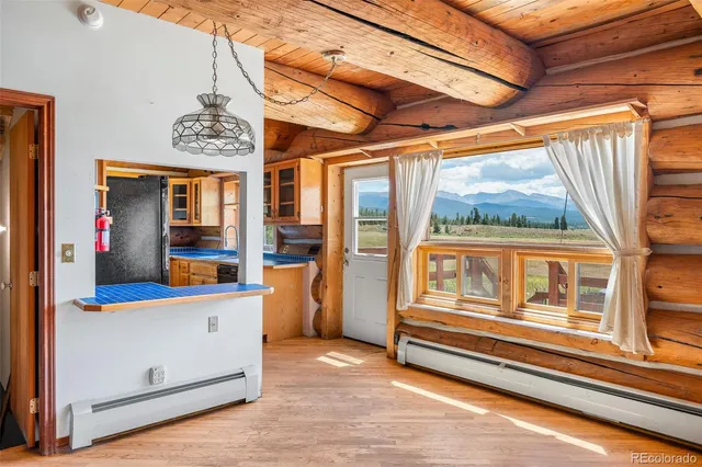 a kitchen with stainless steel appliances kitchen island granite countertop a refrigerator and a stove