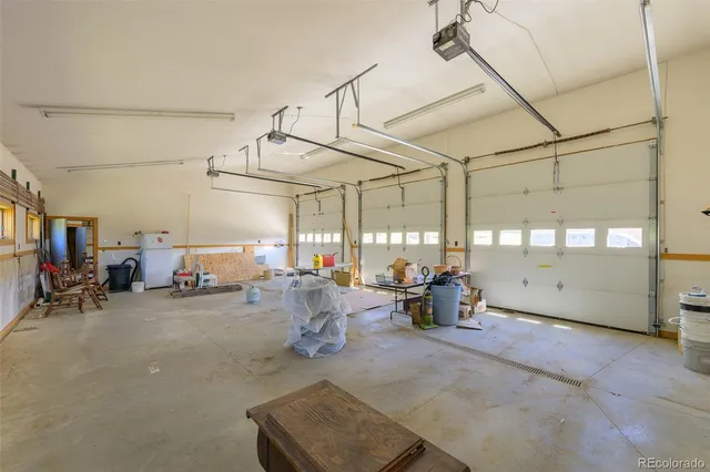 a view of a livingroom with dining room and furniture