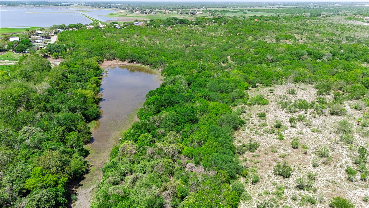 0 County Road 441 Mathis, TX 78368 - Photo 17 of 25 an aerial view of residential house with outdoor space and trees all around