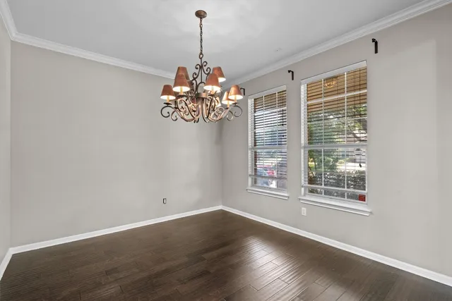 a view of a windows and chandelier in a room