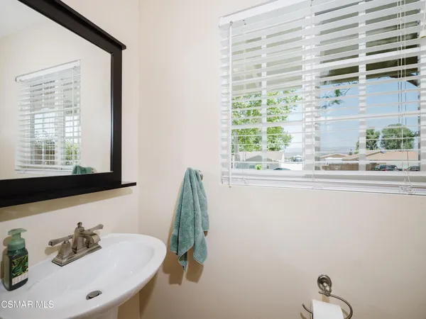 a bathroom with a sink and a window