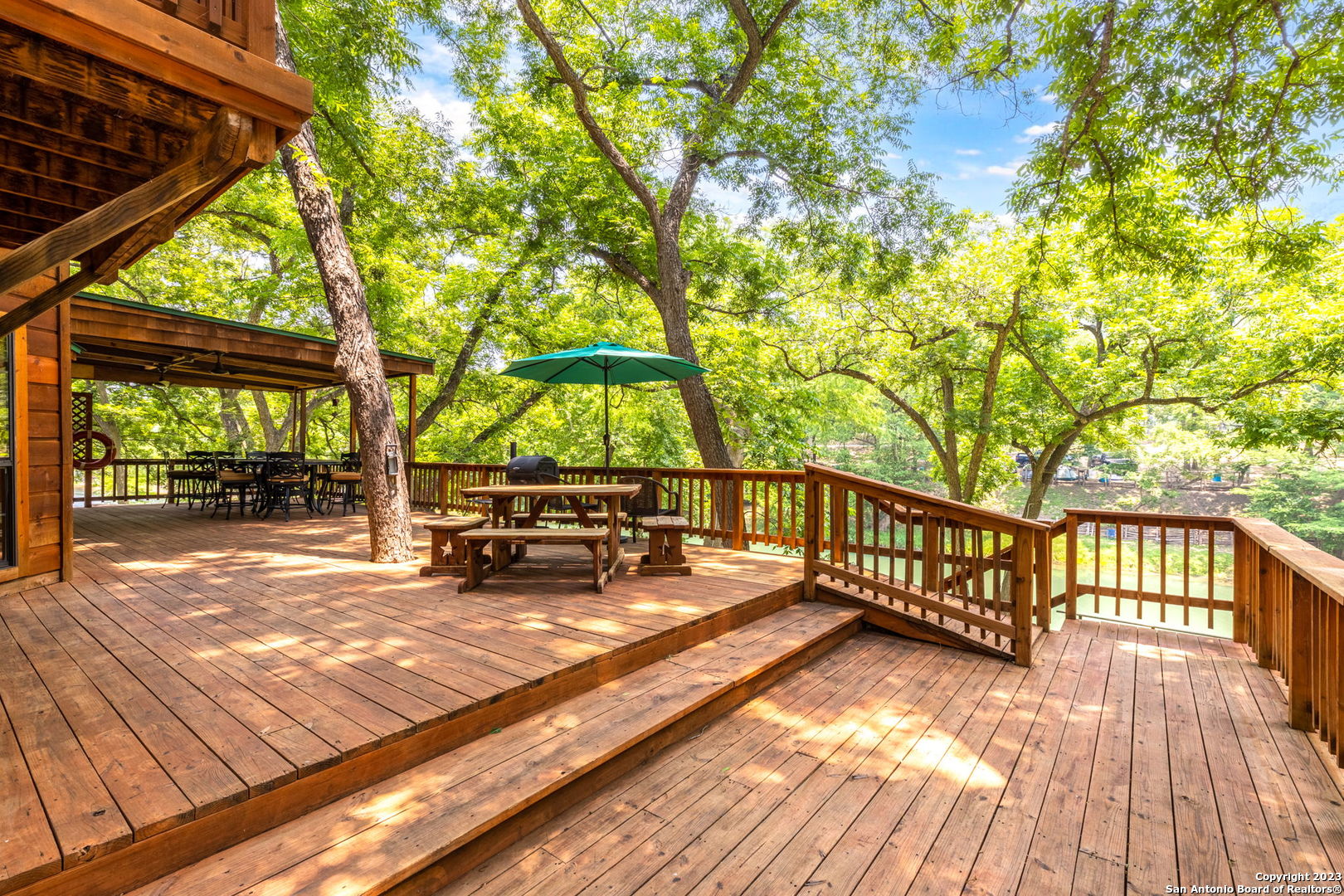 a view of a wooden deck with a patio