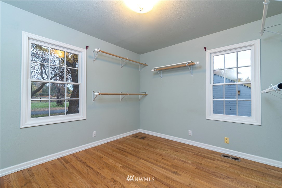 510 East Bender Road Ellensburg, WA 98926 - Photo 15 of 28 an empty room with wooden floor and windows
