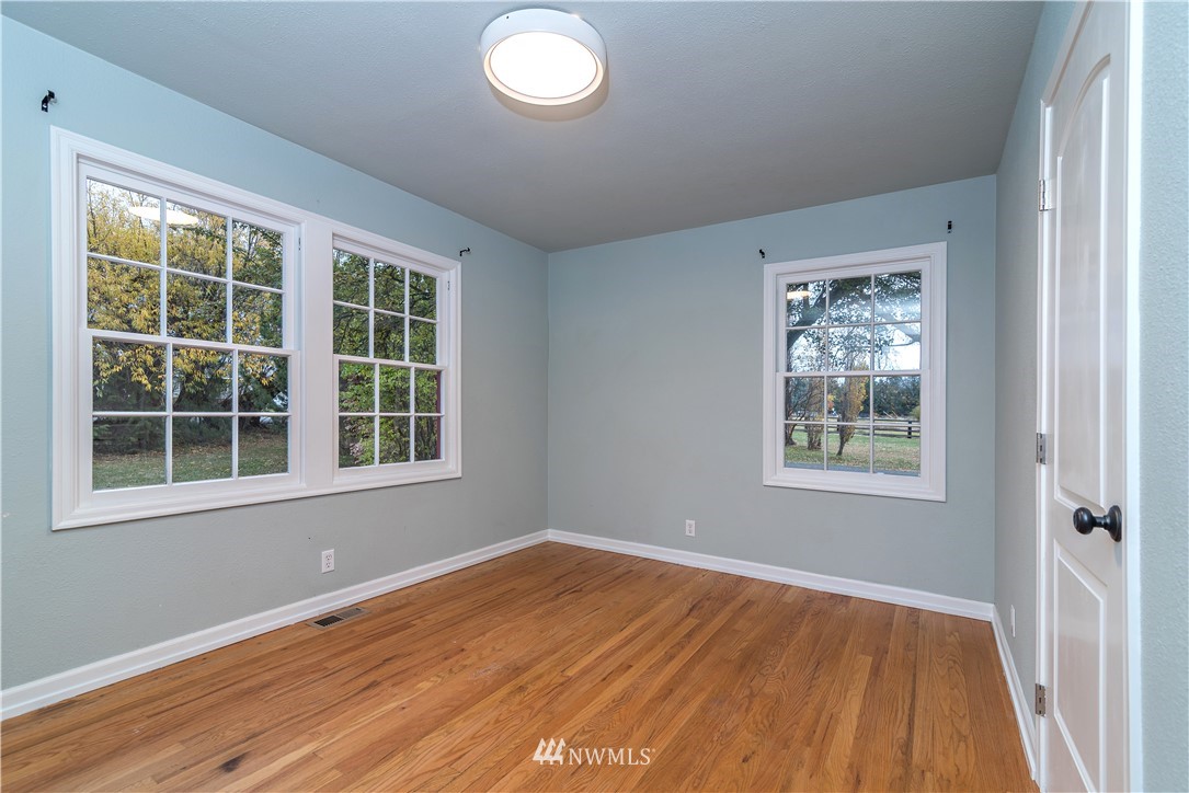 510 East Bender Road Ellensburg, WA 98926 - Photo 17 of 28 an empty room with wooden floor and windows