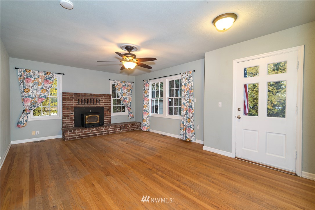 510 East Bender Road Ellensburg, WA 98926 - Photo 2 of 28 a view of an empty room with a fireplace and a window