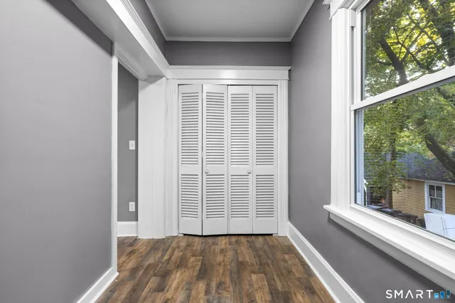 a view of a room with a large window