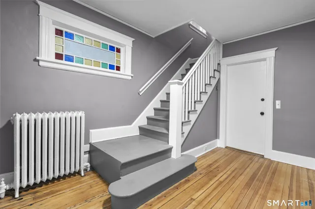a view of entryway with wooden floor