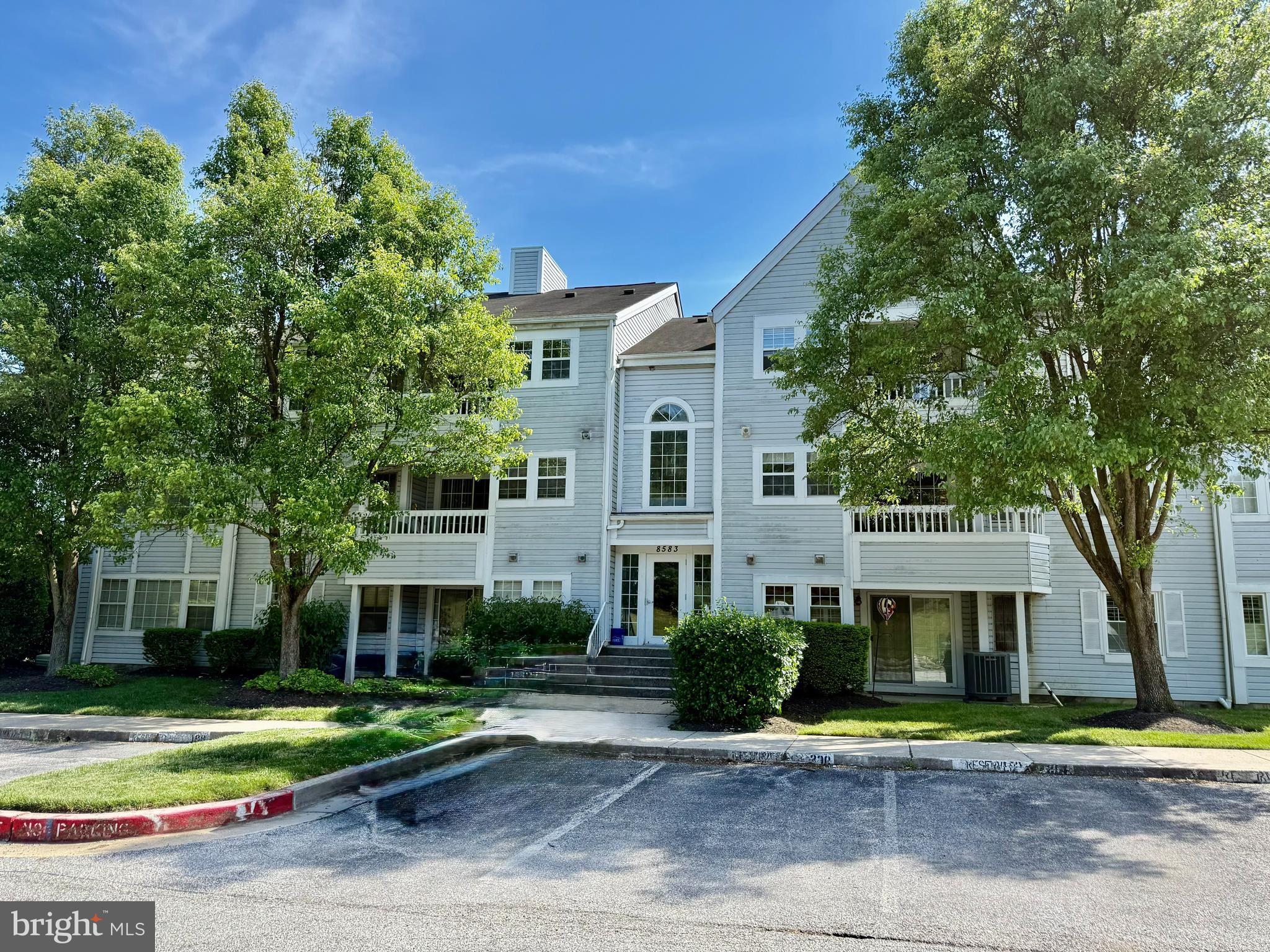 8583 Falls Run Road, Unit B Ellicott City, MD 21043 - Photo 1 of 40 a front view of a house with a yard