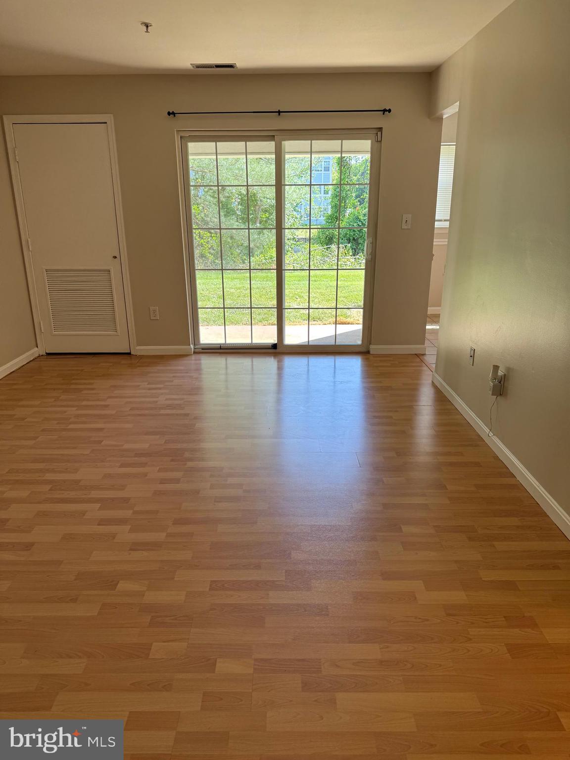 8583 Falls Run Road, Unit B Ellicott City, MD 21043 - Photo 25 of 40 a view of empty room with wooden floor and fan