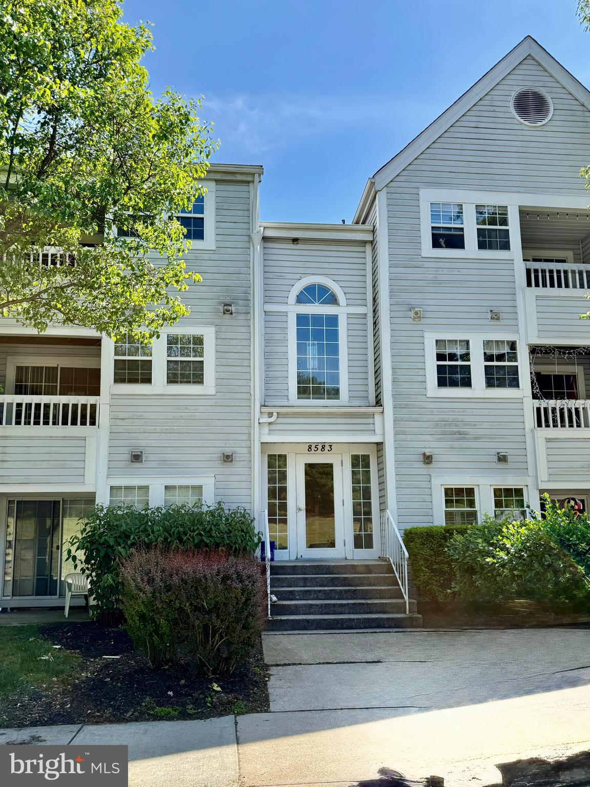 8583 Falls Run Road, Unit B Ellicott City, MD 21043 - Photo 7 of 40 a front view of a house with a yard