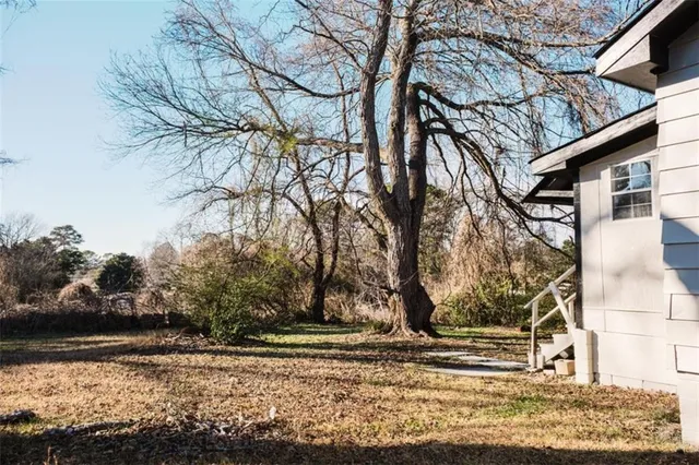 a backyard of a house with lots of green space