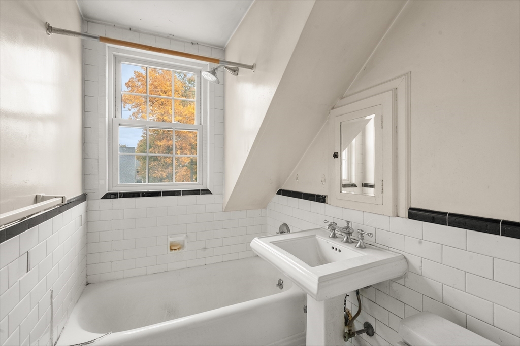 88 Decker Street Milton, MA 02186 - Photo 17 of 20 a bathroom with a sink and a bathtub