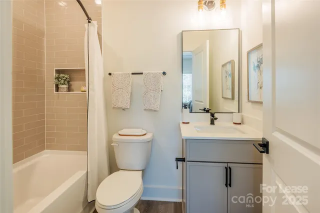 a bathroom with a toilet a sink and a bathtub