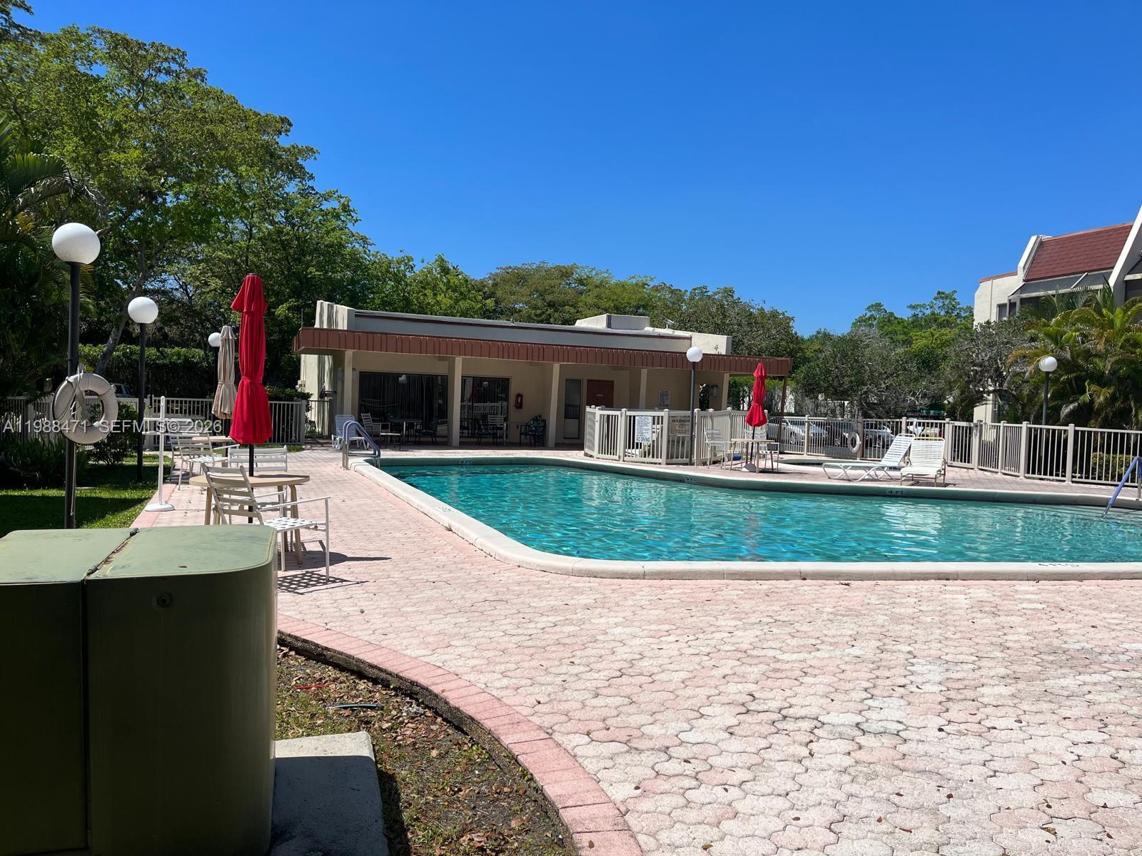 301 North Pine Island Road, Unit 156 Plantation, FL 33324 - Photo 13 of 16 a view of a house with a swimming pool