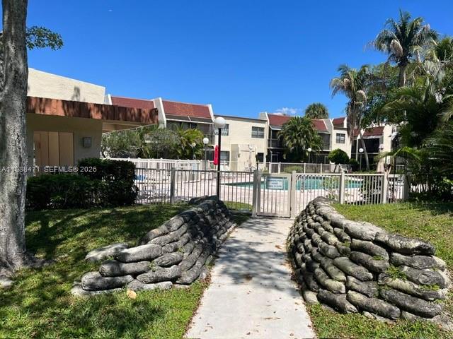 301 North Pine Island Road, Unit 156 Plantation, FL 33324 - Photo 14 of 16 a view of a garden with patio
