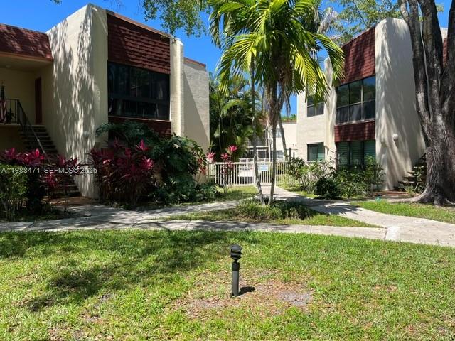 301 North Pine Island Road, Unit 156 Plantation, FL 33324 - Photo 16 of 16 a view of a house with a yard and tree s