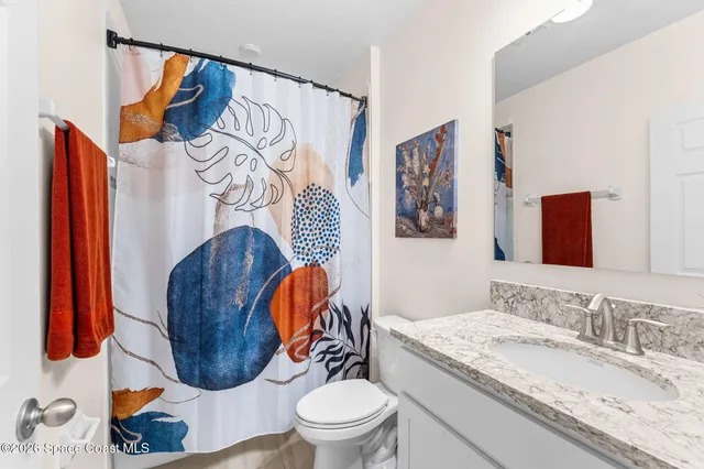 a view of storage and utility room with racks on the wall