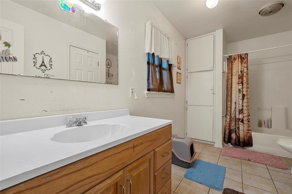 5288 Ft Graham Road West, TX 76691 - Photo 12 of 19 a bathroom with a sink and a mirror