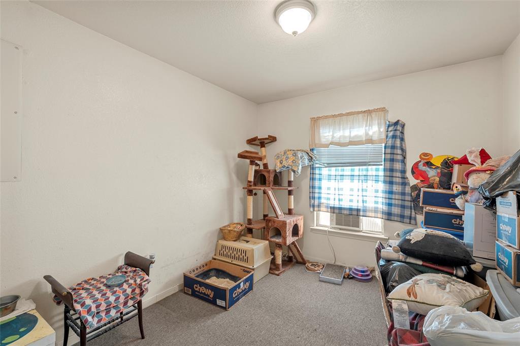 5288 Ft Graham Road West, TX 76691 - Photo 15 of 19 a room with furniture a gym equipment and a chandelier