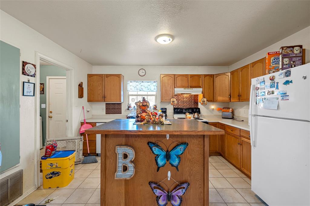 5288 Ft Graham Road West, TX 76691 - Photo 7 of 19 a kitchen with stainless steel appliances a refrigerator and a sink