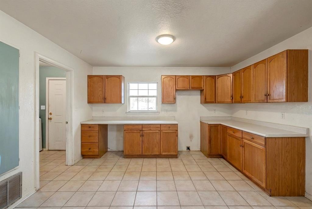 5288 Ft Graham Road West, TX 76691 - Photo 8 of 19 a large kitchen with stainless steel appliances granite countertop a sink and cabinets