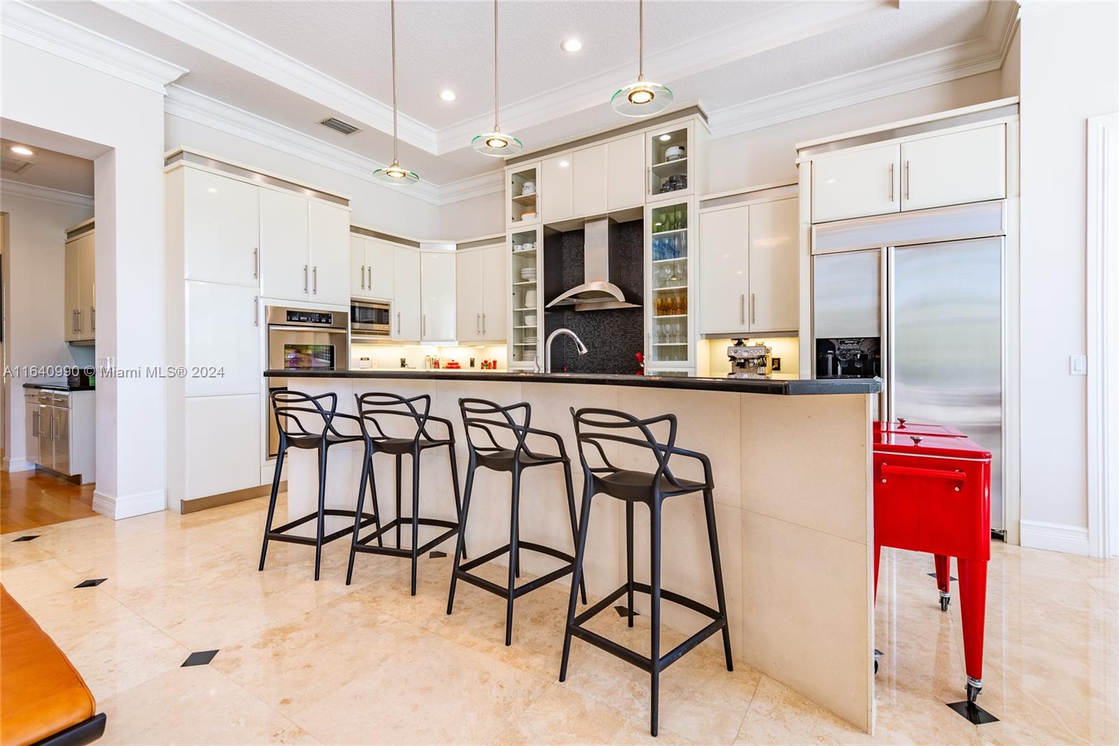 17586 Middlebrook Way Boca Raton, FL 33496 - Photo 13 of 86 a kitchen with stainless steel appliances kitchen island granite countertop a table chairs sink and cabinets