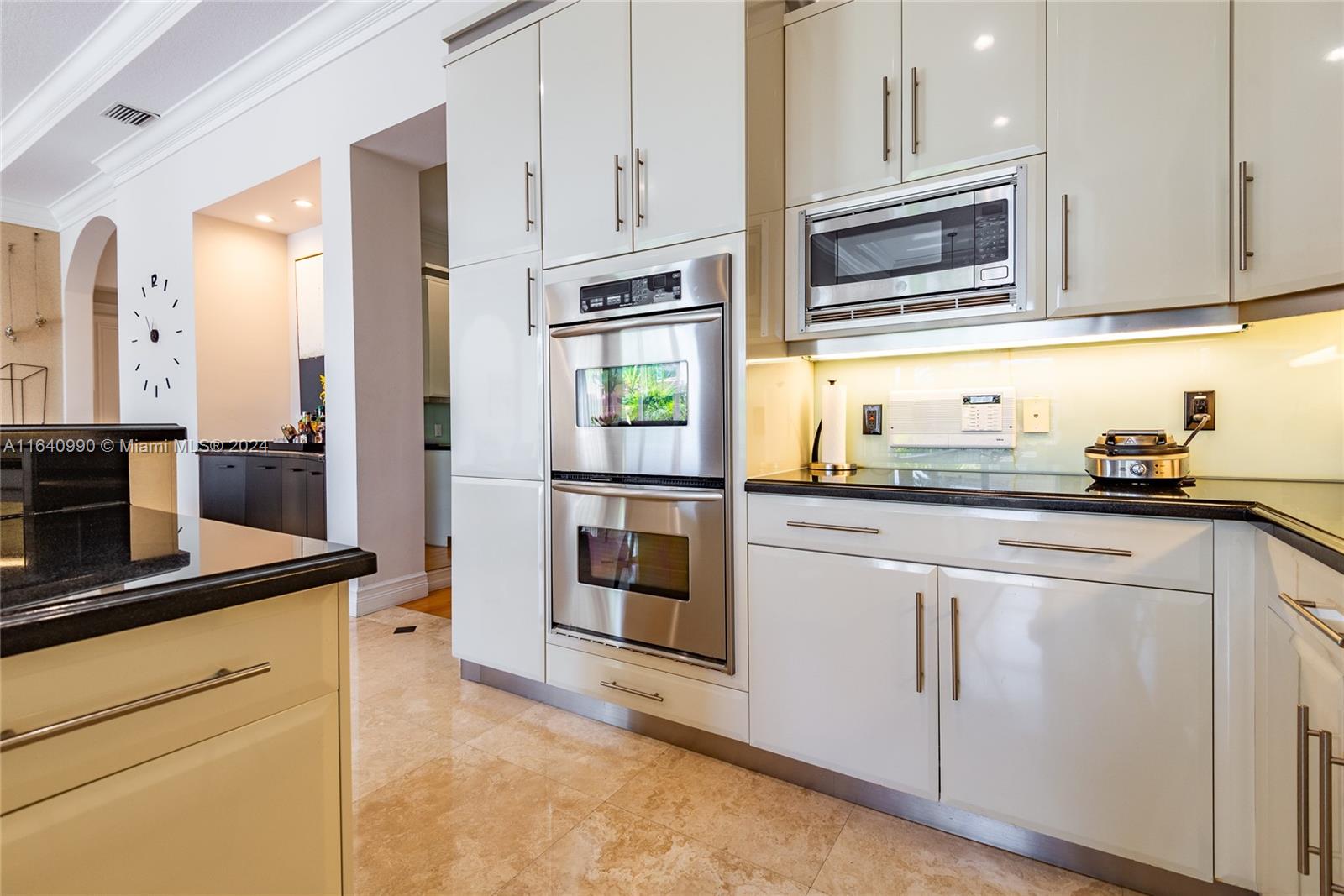 17586 Middlebrook Way Boca Raton, FL 33496 - Photo 15 of 86 a kitchen with stainless steel appliances white cabinets and a granite counter tops