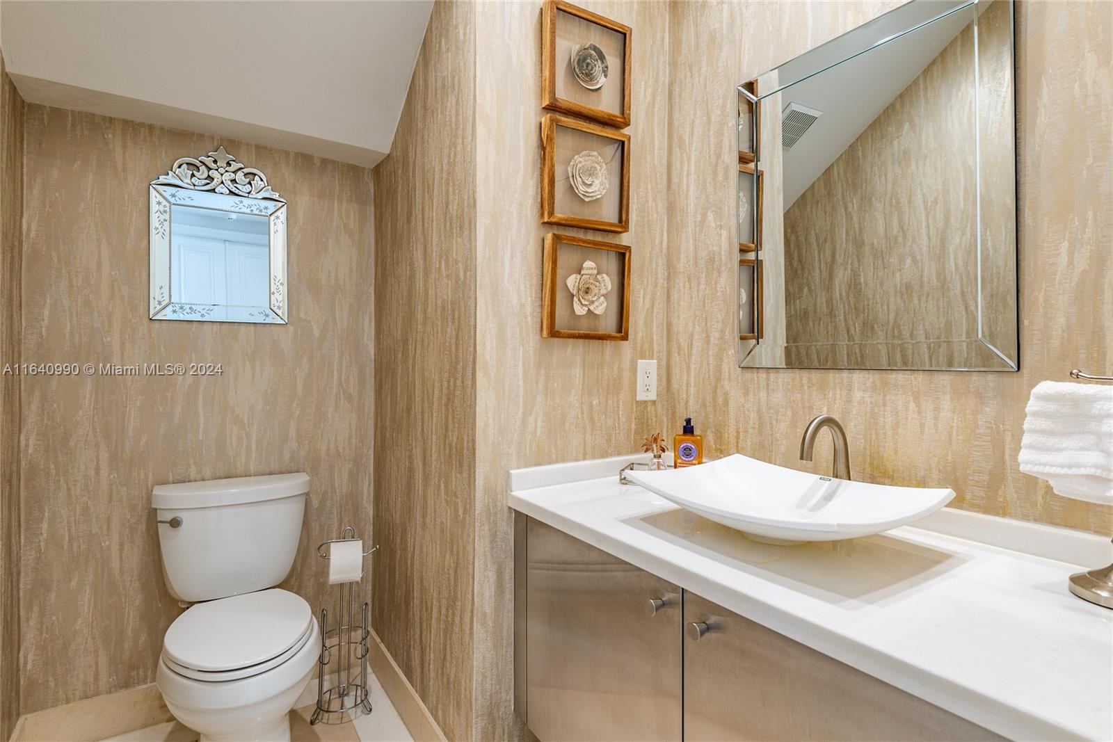 17586 Middlebrook Way Boca Raton, FL 33496 - Photo 28 of 86 a bathroom with a toilet sink and mirror