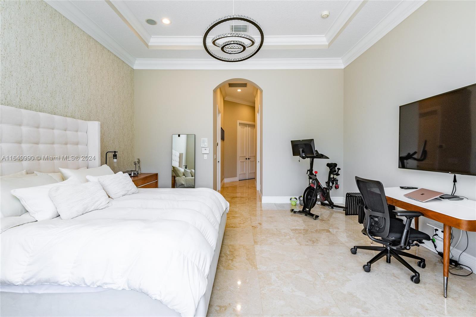 17586 Middlebrook Way Boca Raton, FL 33496 - Photo 34 of 86 a bedroom with a bed and a flat tv screen on the dresser