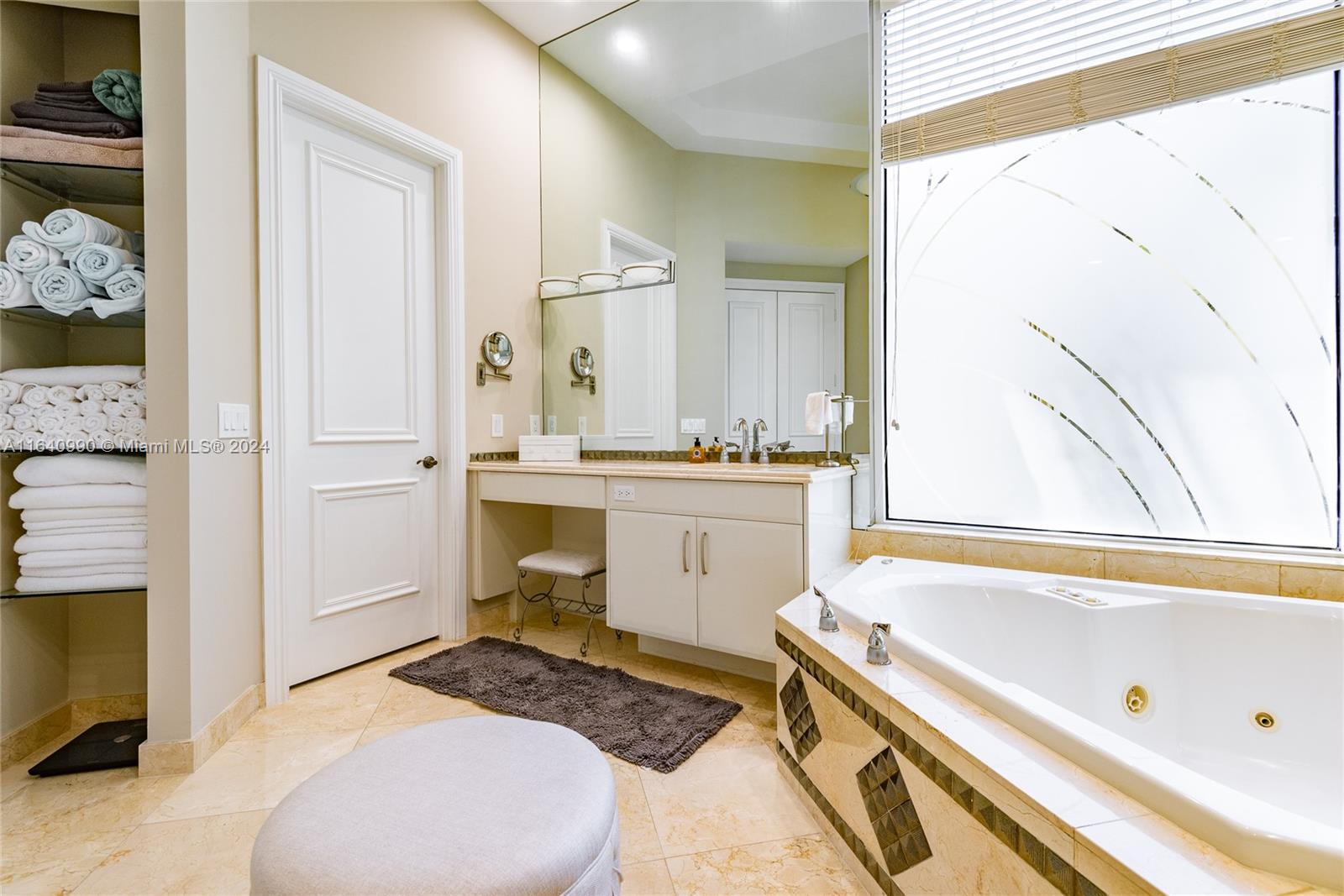 17586 Middlebrook Way Boca Raton, FL 33496 - Photo 35 of 86 a spacious bathroom with a tub sink and a window