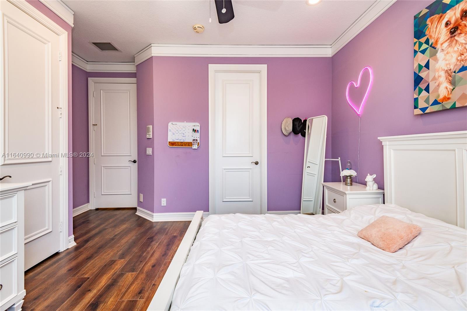 17586 Middlebrook Way Boca Raton, FL 33496 - Photo 48 of 86 a bedroom with a bed and wooden floor