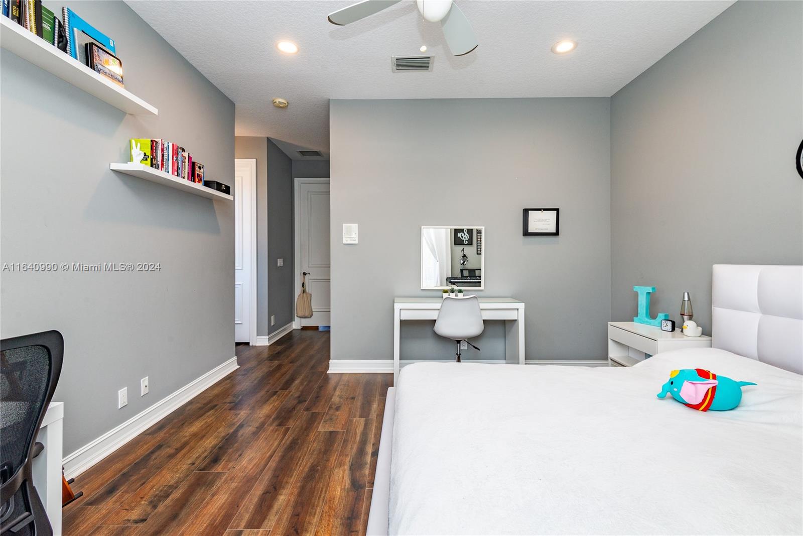 17586 Middlebrook Way Boca Raton, FL 33496 - Photo 55 of 86 a bedroom with furniture and a wooden floor