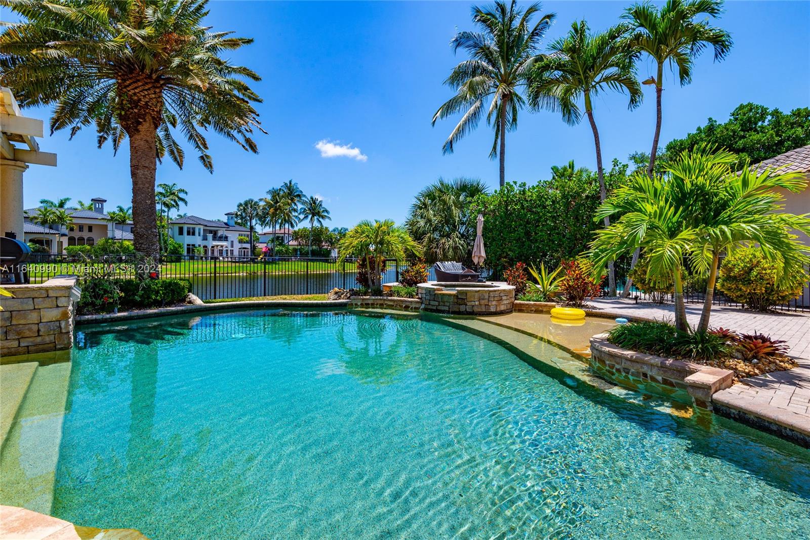 17586 Middlebrook Way Boca Raton, FL 33496 - Photo 60 of 86 a view of swimming pool with a table and chairs