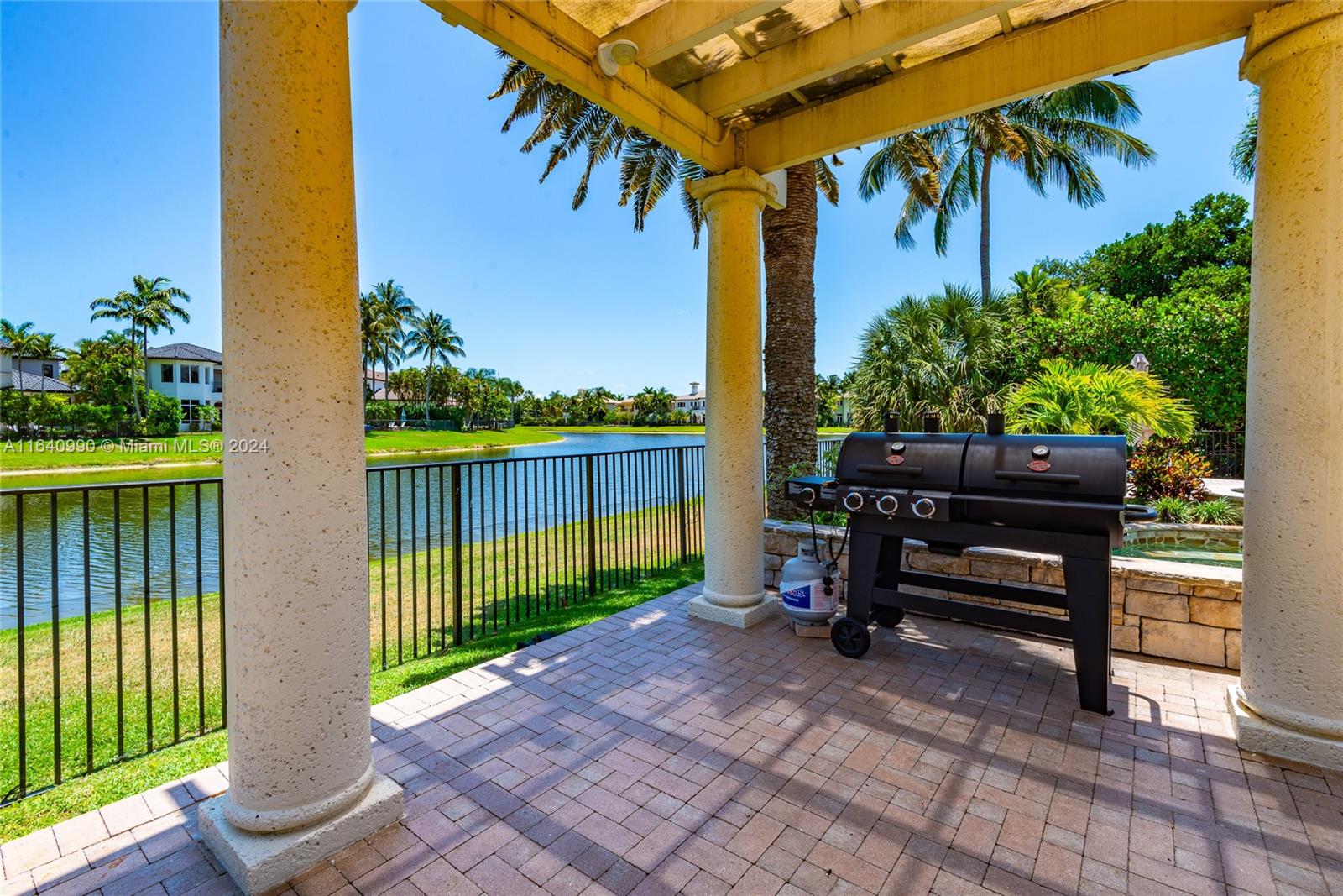 17586 Middlebrook Way Boca Raton, FL 33496 - Photo 63 of 86 a view of a bench in the patio in front of a house
