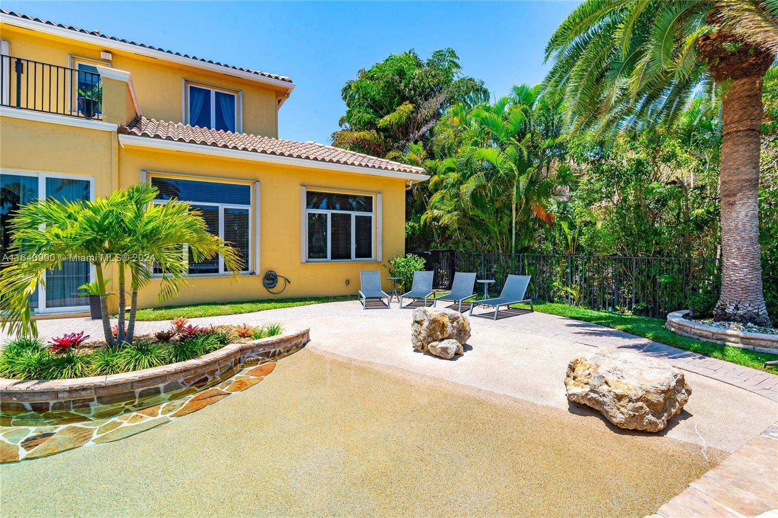 17586 Middlebrook Way Boca Raton, FL 33496 - Photo 65 of 86 front view of a house with a patio