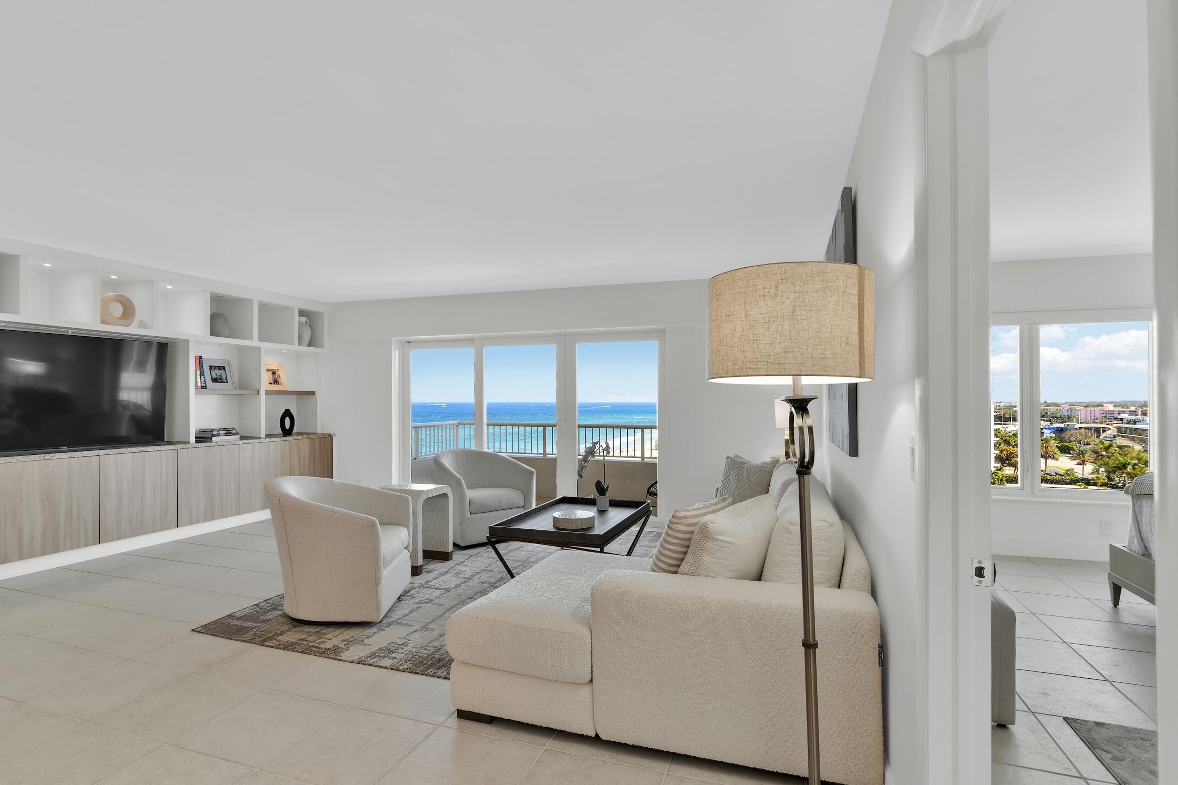 600 South Ocean Boulevard, Unit 802 Boca Raton, FL 33432 - Photo 3 of 27 a living room with furniture and a flat screen tv