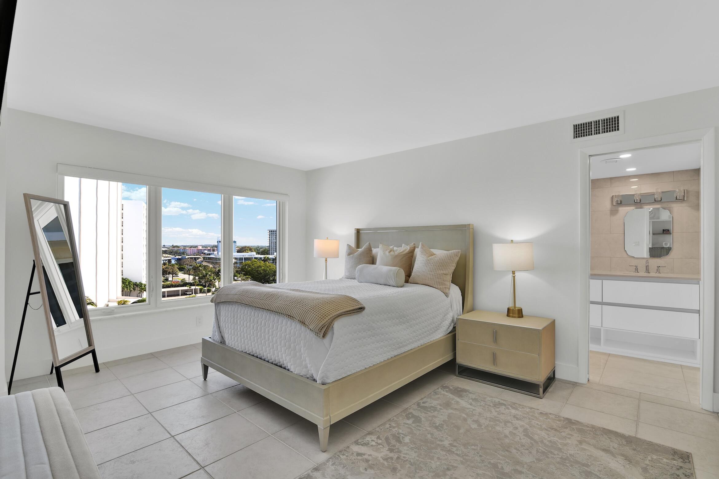 600 South Ocean Boulevard, Unit 802 Boca Raton, FL 33432 - Photo 6 of 27 a spacious bedroom with a bed and a large window