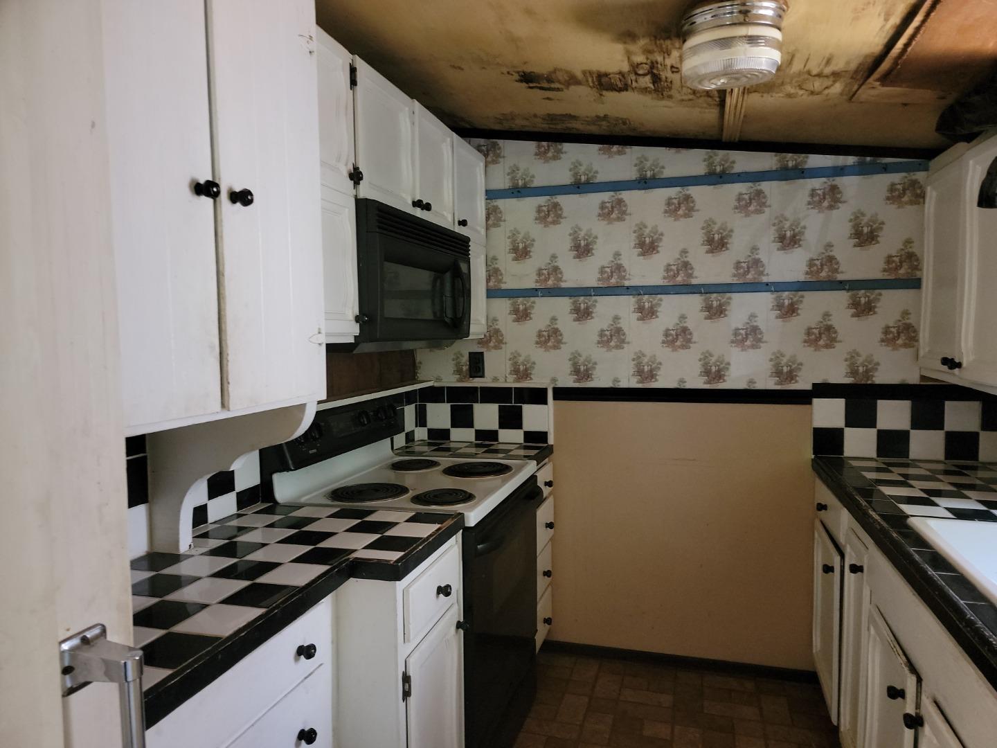 159 Strawberry Road Watsonville, CA 95076 - Photo 46 of 109 a kitchen with a stove and a microwave