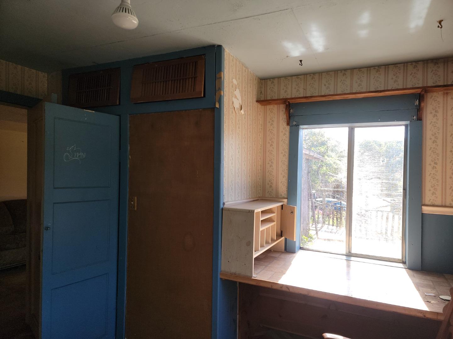 159 Strawberry Road Watsonville, CA 95076 - Photo 55 of 109 a view of a hallway with wooden floor and a cabinet