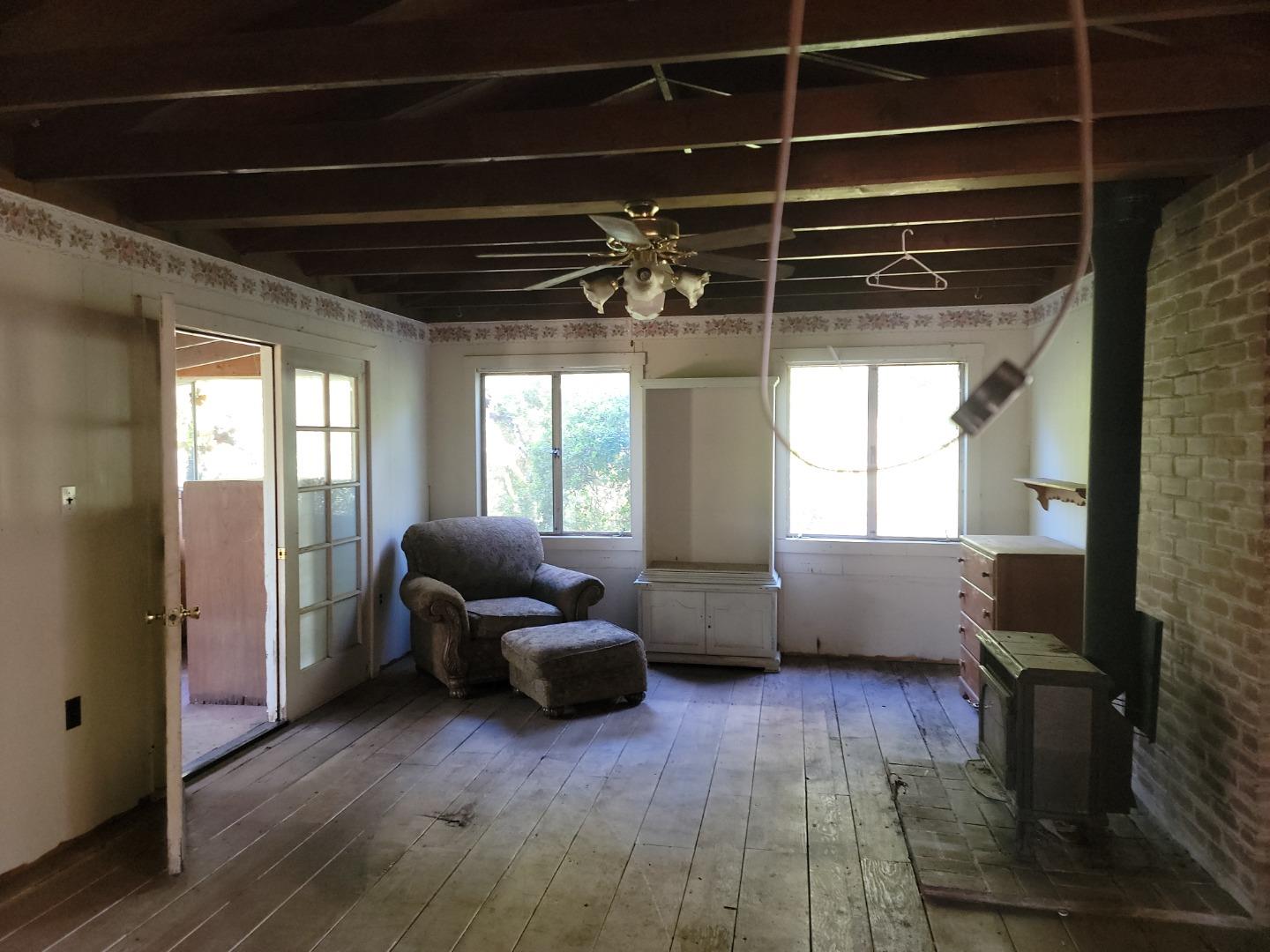 159 Strawberry Road Watsonville, CA 95076 - Photo 58 of 109 a living room with furniture windows and a chandelier